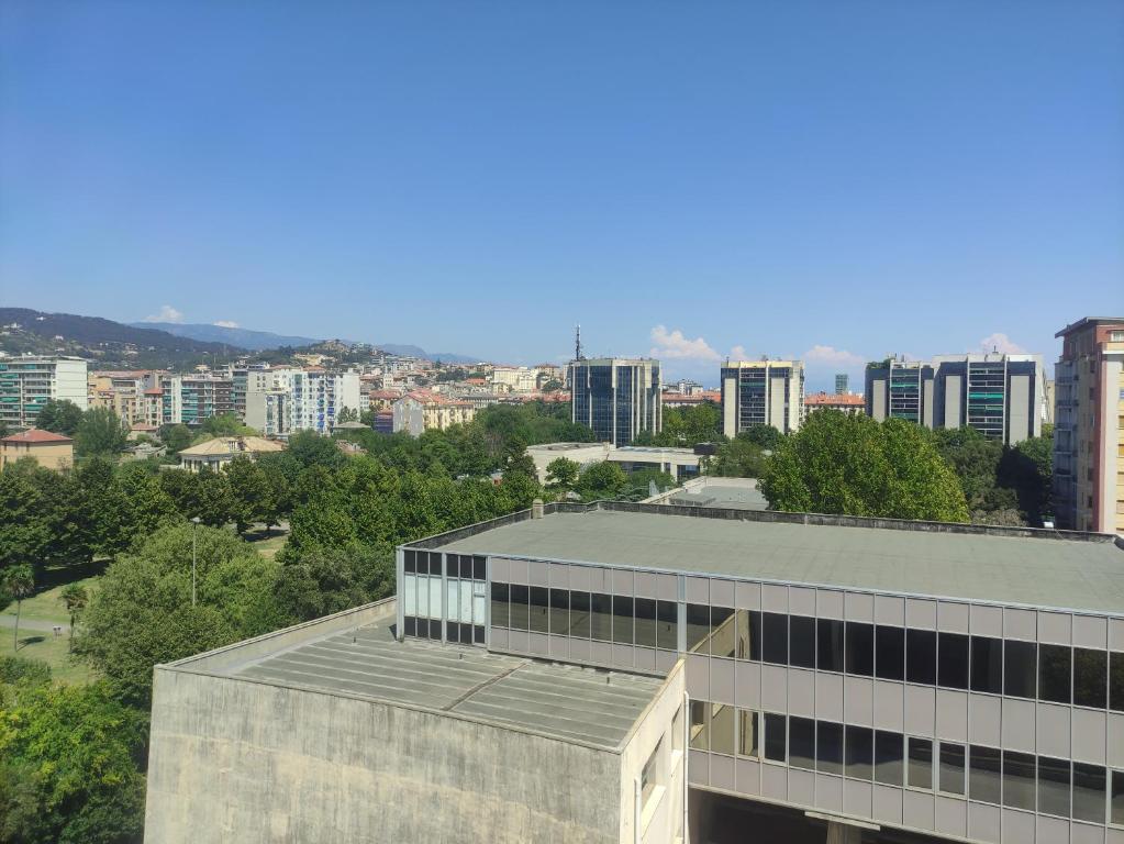an office building with a city in the background at Una finestra su Savona in Savona