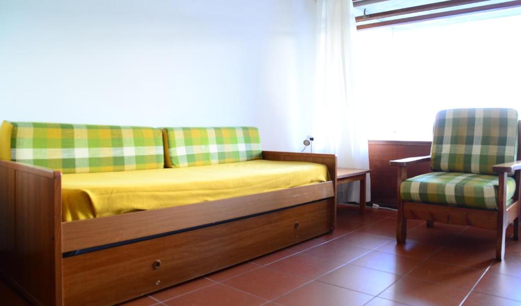 Postel nebo postele na pokoji v ubytování Residence Napoleon - HelloElba