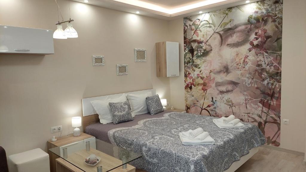 A bed or beds in a room at Sunrise City A1, Sarafovo