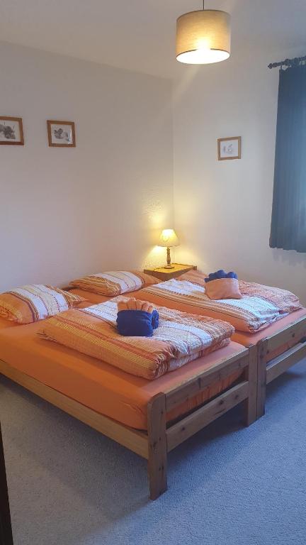 two twin beds in a room with at Les RHODOS 3 in Les Crosets