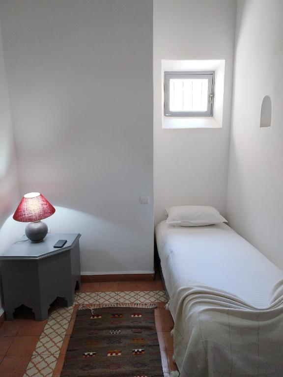 Кровать или кровати в номере RIAD MAROSKO