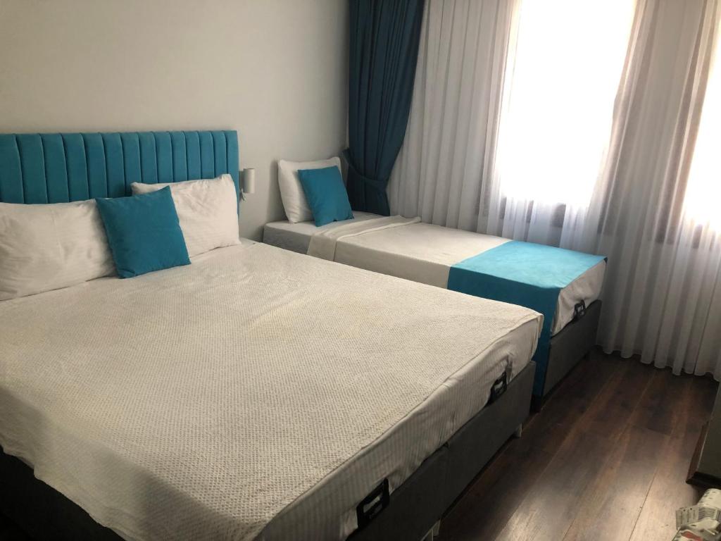 A bed or beds in a room at Nos Istanbul