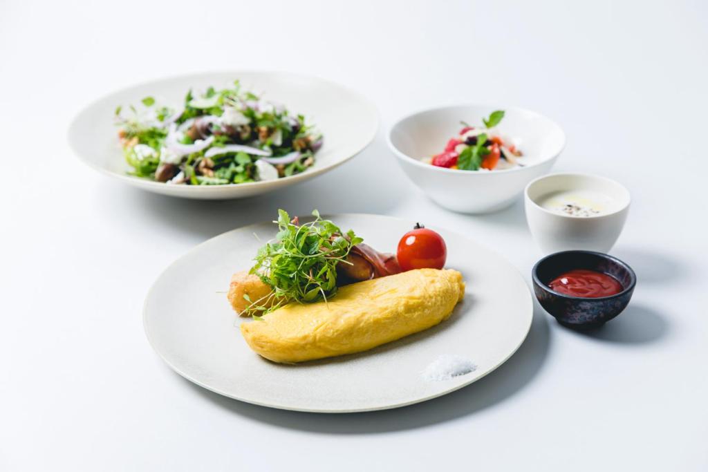 a plate of food with a pastry and a salad at Dhawa Yura Kyoto - Banyan Group in Kyoto