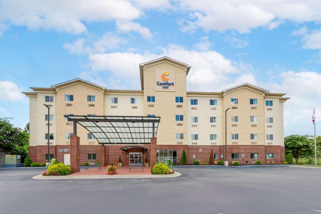 a hotel with a sign on the front of it at Comfort Inn Huntsville near University in Huntsville