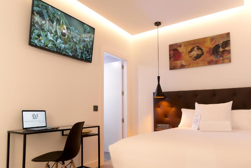 Televízia a/alebo spoločenská miestnosť v ubytovaní Woohoo Rooms Boutique Sol