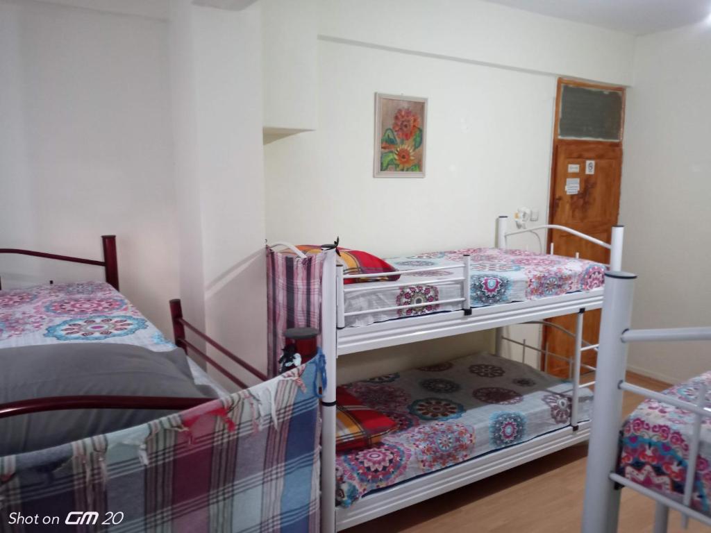 Postel nebo postele na pokoji v ubytování HZD Apartments Hostel