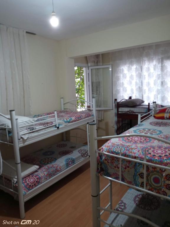 Postel nebo postele na pokoji v ubytování HZD Apartments Hostel