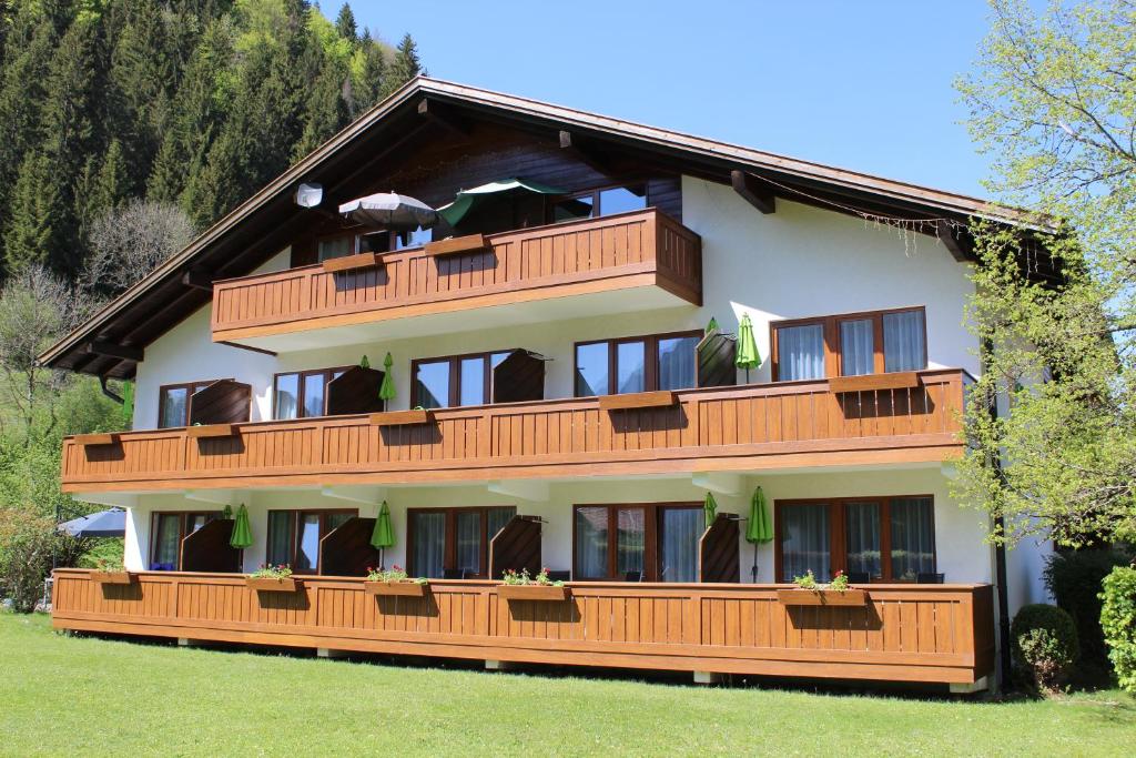 a building with balconies on the side of it at Appartement-Hotel Happy Kienberg in Pfronten