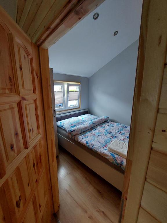 Postel nebo postele na pokoji v ubytování Domki