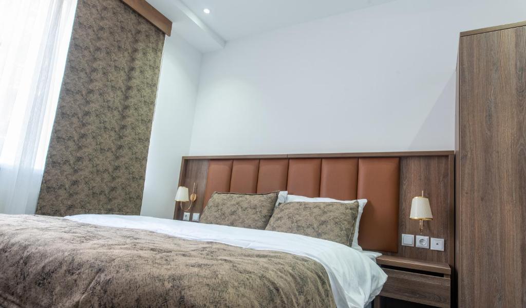 Postel nebo postele na pokoji v ubytování Hotel Cataleya