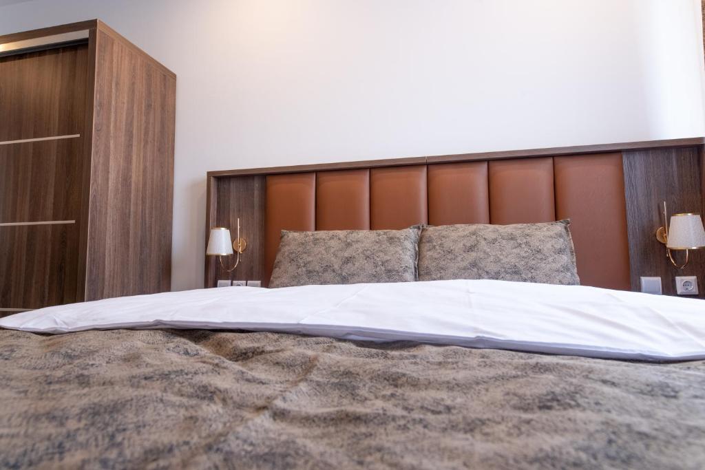 Postel nebo postele na pokoji v ubytování Hotel Cataleya