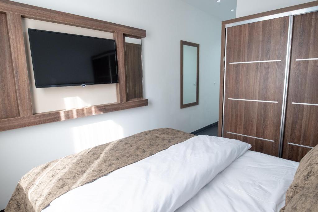 Postel nebo postele na pokoji v ubytování Hotel Cataleya