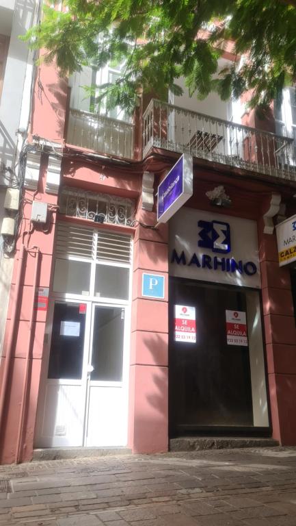 a building with a door and a sign on it at Pensión Casablanca in Santa Cruz de Tenerife