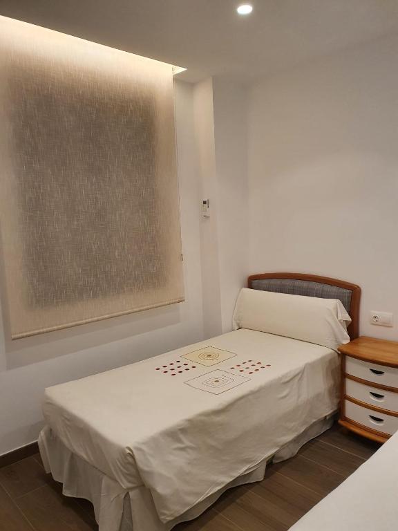 Posteľ alebo postele v izbe v ubytovaní Apartamento Trinidad Grund