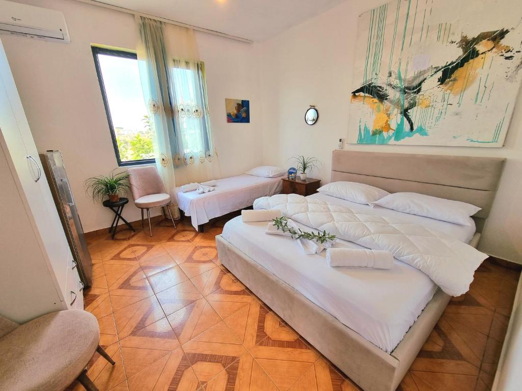 GUEST HOUSE VILA ELEZIにあるベッド
