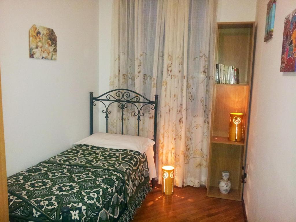 A bed or beds in a room at Assisi Casa degli Angeli
