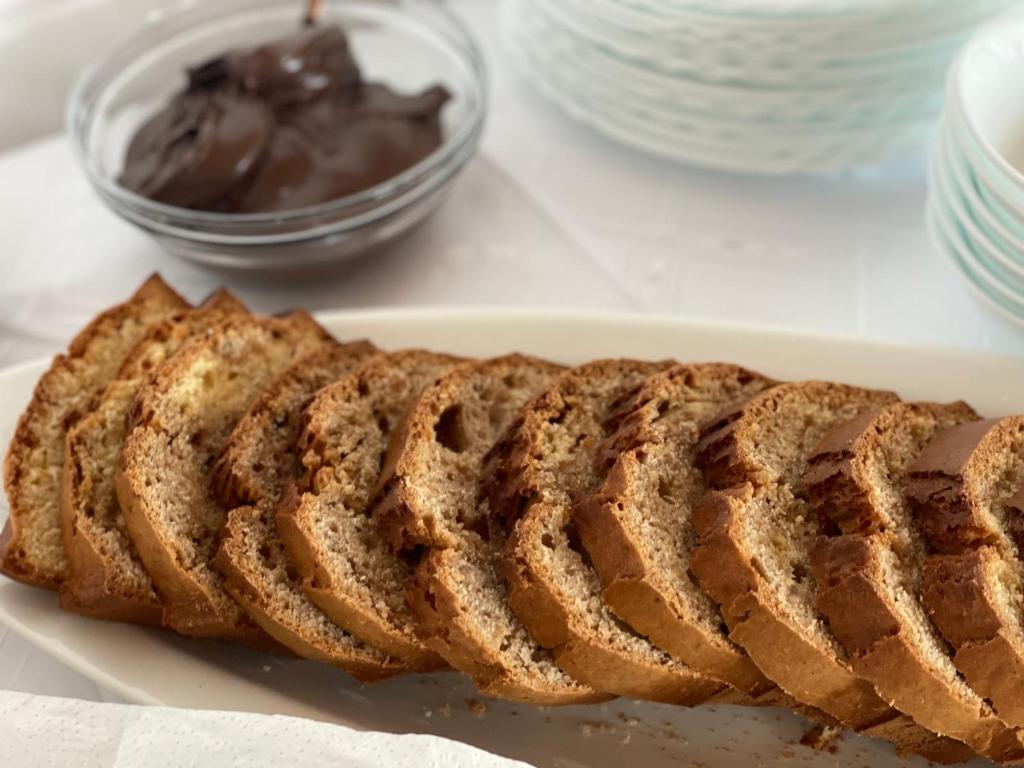 a loaf of bread on a plate with chocolate at SEA & LAKE VIEW VILLA in (( Kalive Gjoka ))