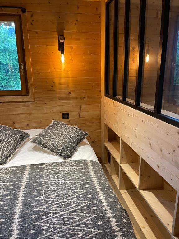 Postel nebo postele na pokoji v ubytování Marmotte du Jaillet Cosy and charmant appartement
