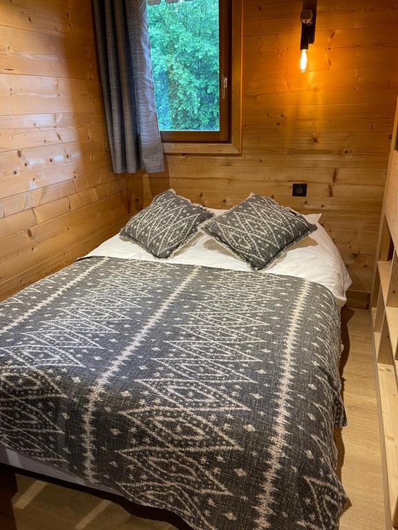 Postel nebo postele na pokoji v ubytování Marmotte du Jaillet Cosy and charmant appartement