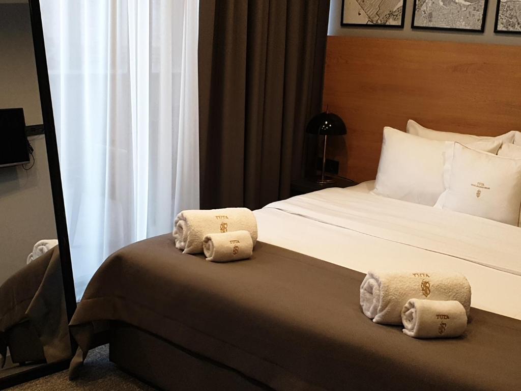 Postel nebo postele na pokoji v ubytování Hotel Tuta