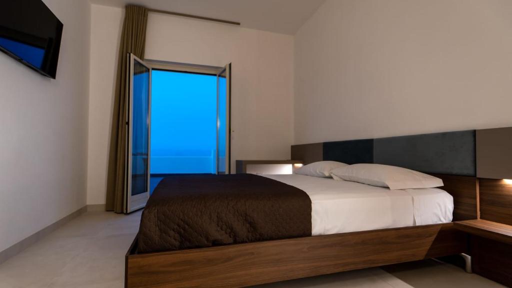 Postel nebo postele na pokoji v ubytování Terrazza sul Mare