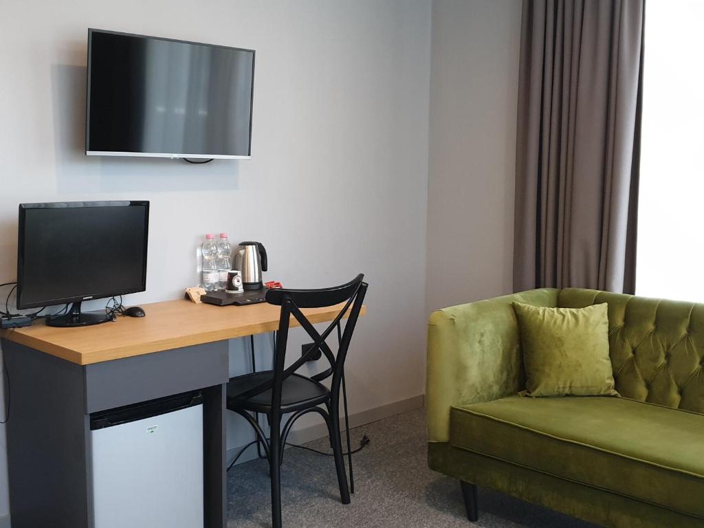 TV a/nebo společenská místnost v ubytování Hotel Tuta