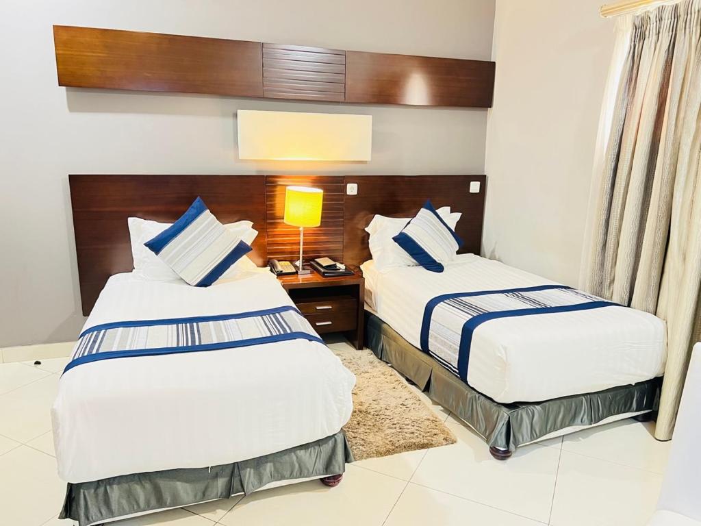 Postel nebo postele na pokoji v ubytování Hotel Amirana