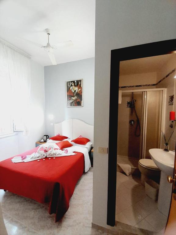 Postel nebo postele na pokoji v ubytování Hotel Castelfidardo