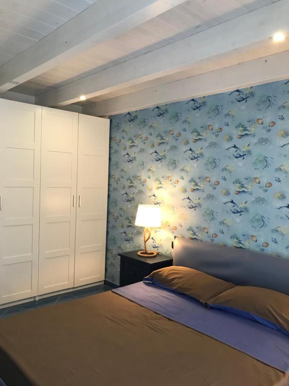 Postel nebo postele na pokoji v ubytování Tartaruga House