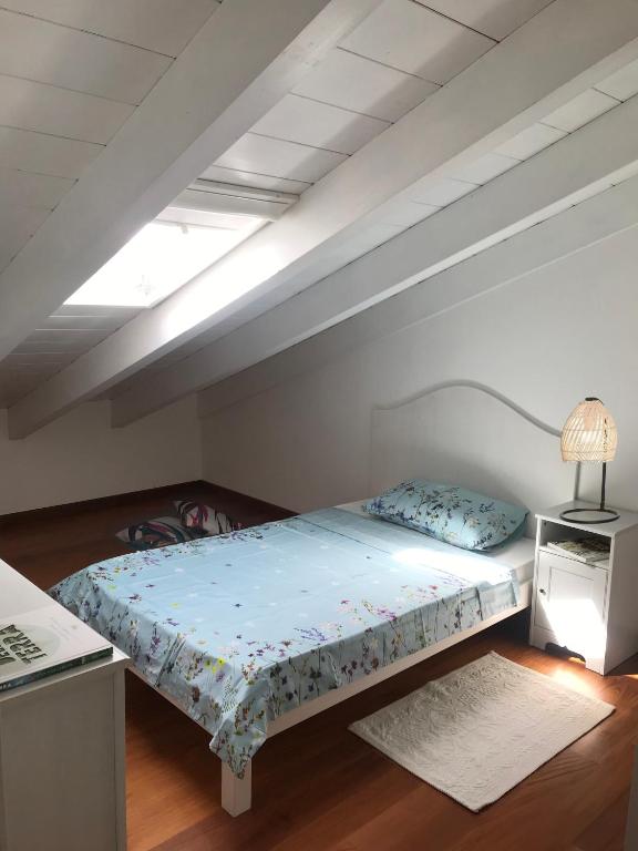 Postel nebo postele na pokoji v ubytování Tartaruga House