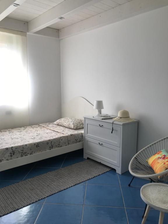 Postel nebo postele na pokoji v ubytování Tartaruga House