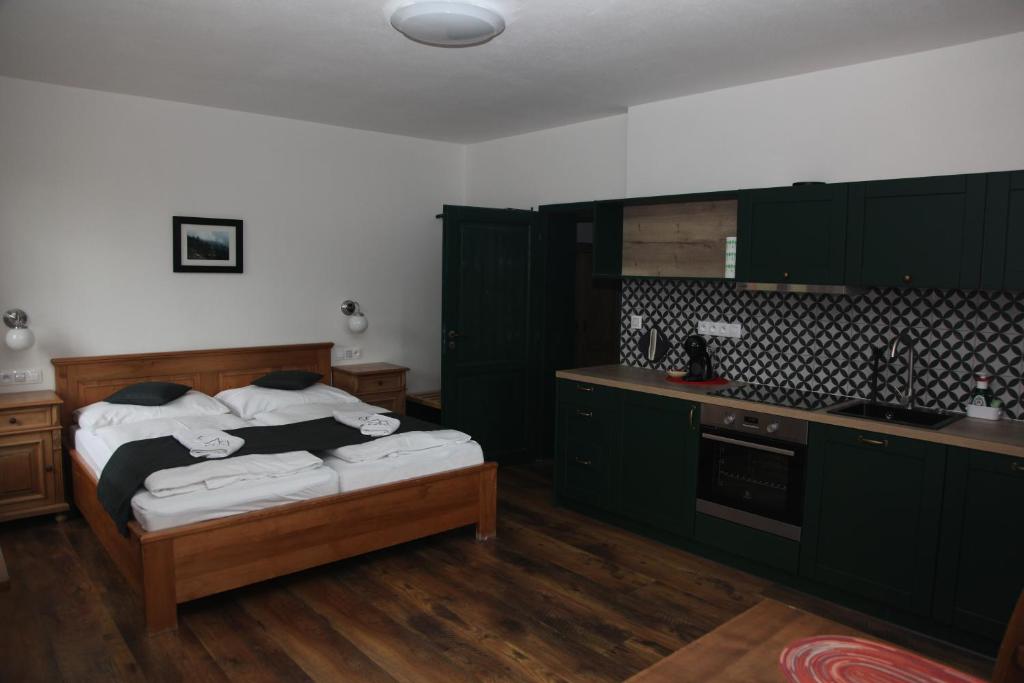 Postel nebo postele na pokoji v ubytování Aparthotel Mádr