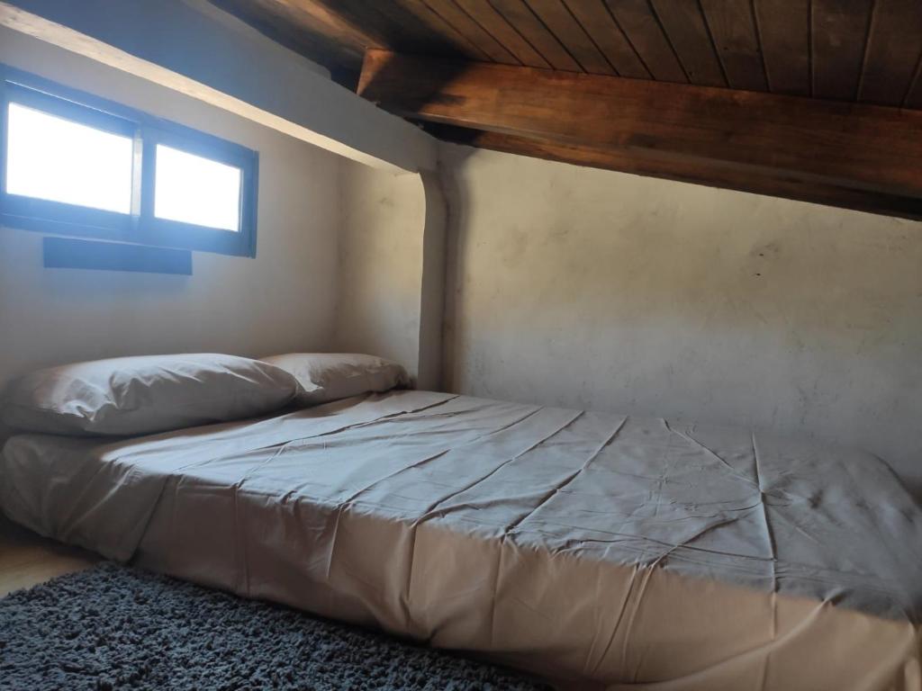 Postel nebo postele na pokoji v ubytování Ático El Más allá