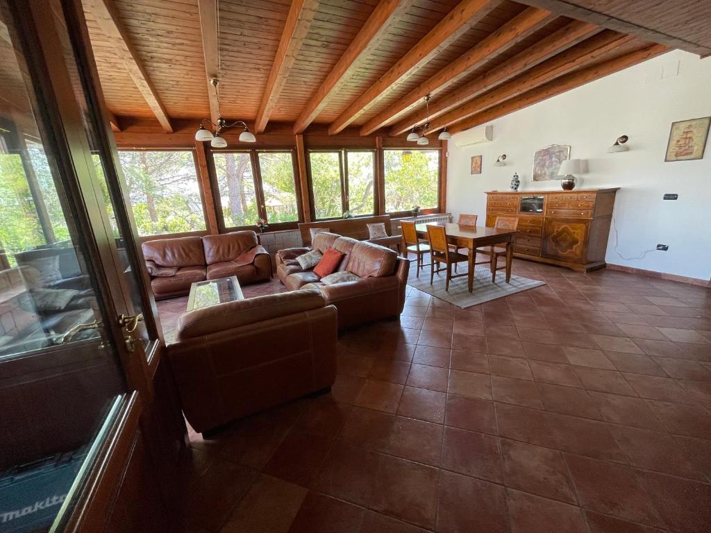 a living room with a couch and a table at Villa Mastricale in Putignano