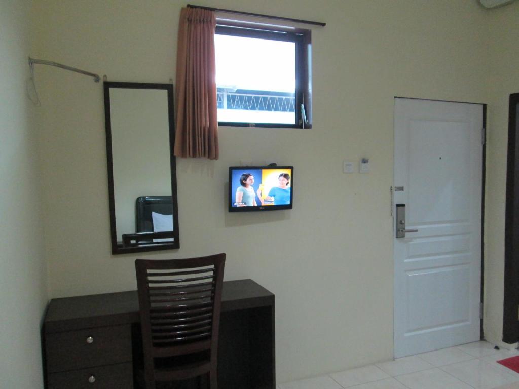 TV a/nebo společenská místnost v ubytování Mahkota Hotel