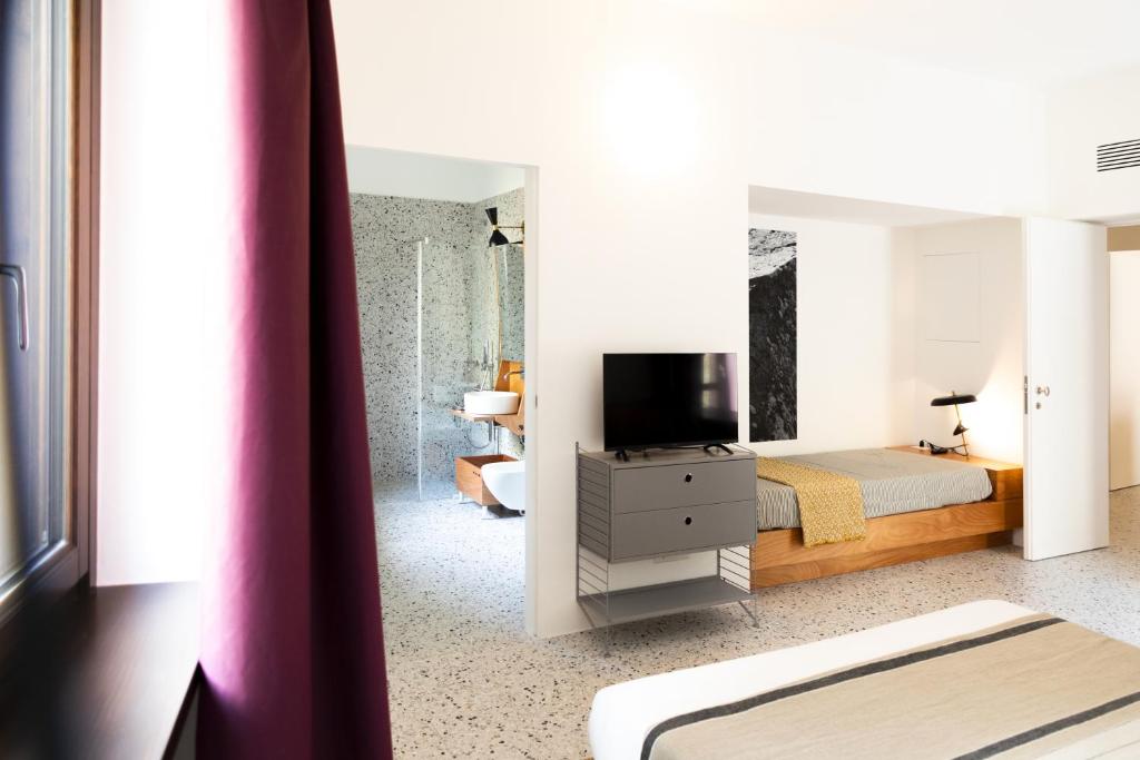 TV a/nebo společenská místnost v ubytování Hotel Dolomiti