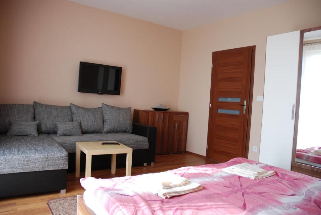 Postel nebo postele na pokoji v ubytování Fridrich apartman