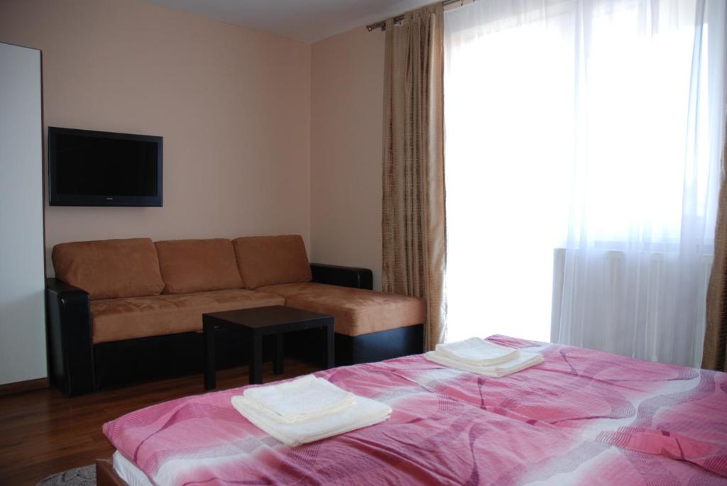 Postel nebo postele na pokoji v ubytování Fridrich apartman