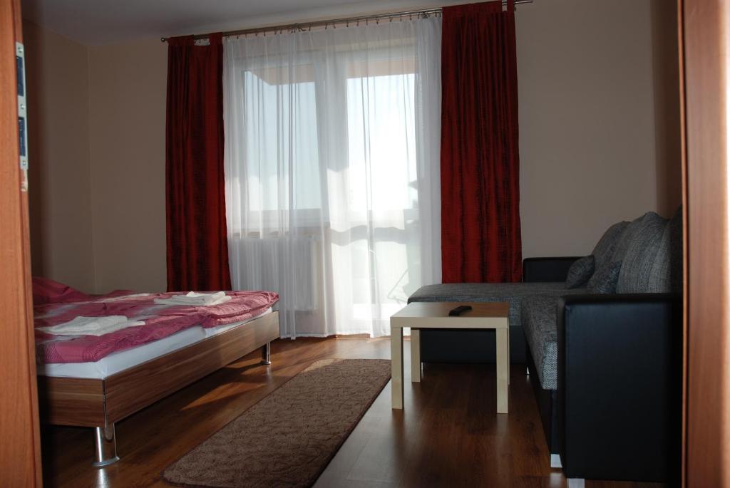 Postel nebo postele na pokoji v ubytování Fridrich apartman