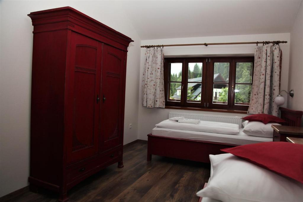 Postel nebo postele na pokoji v ubytování Aparthotel Mádr