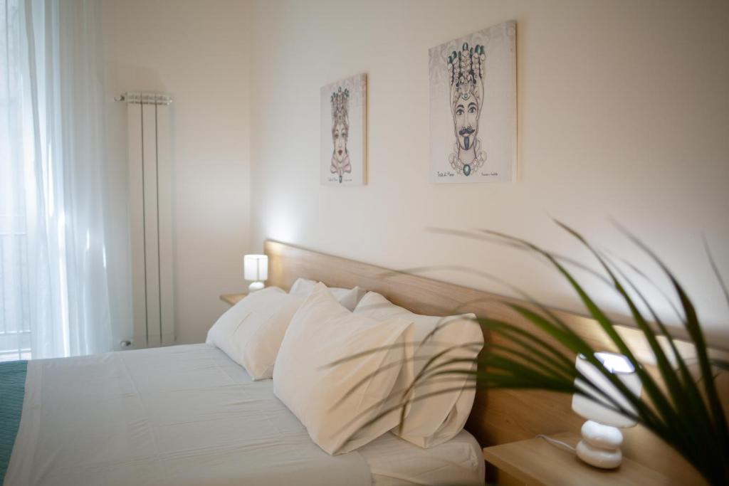 Posteľ alebo postele v izbe v ubytovaní Pupi 93 Rooms