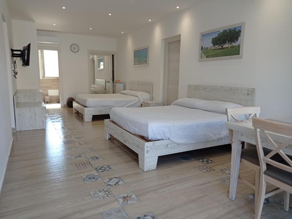 Postel nebo postele na pokoji v ubytování Sicily Rooms Appartamenti