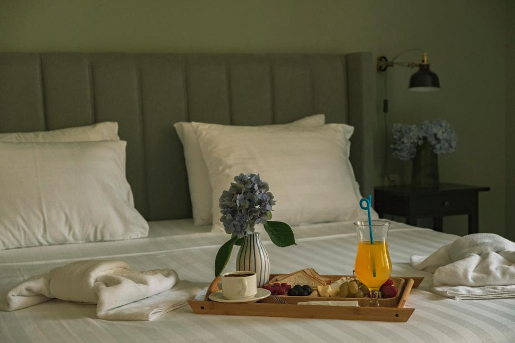 Postel nebo postele na pokoji v ubytování Buxus Hotel Shekvetili