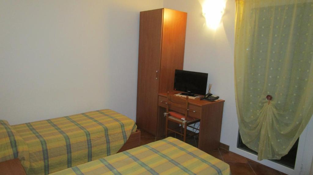 Postel nebo postele na pokoji v ubytování Al Castello