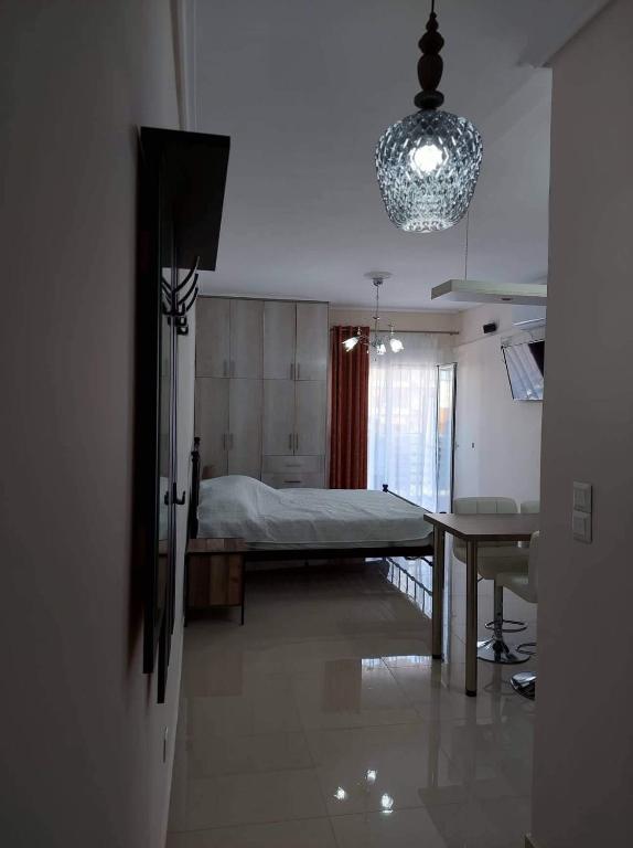 a hospital room with a bed and a table at Loutraki vibes apartments in Loutraki