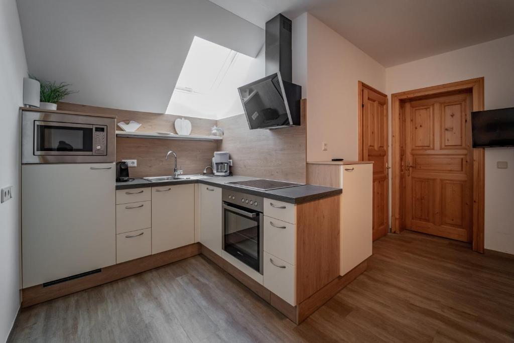 Kuchyň nebo kuchyňský kout v ubytování Landhotel - Apartments Bauer
