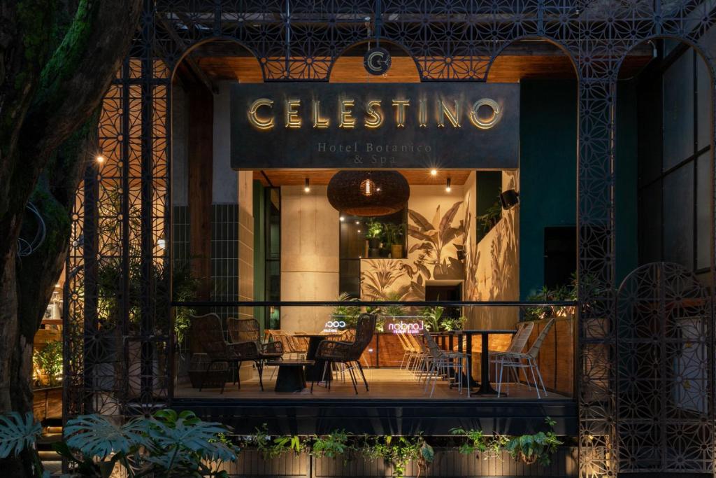 a store front of a restaurant with a table and chairs at Celestino Boutique Hotel in Medellín