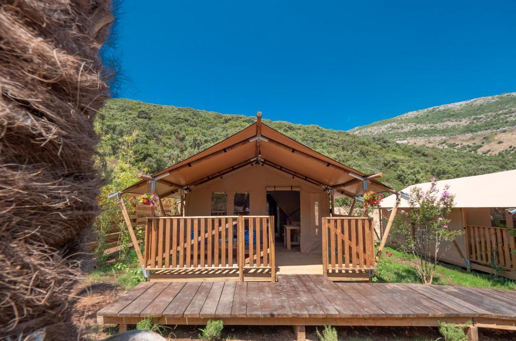 a gazebo with a hill in the background at Sea Glamping in Kotor