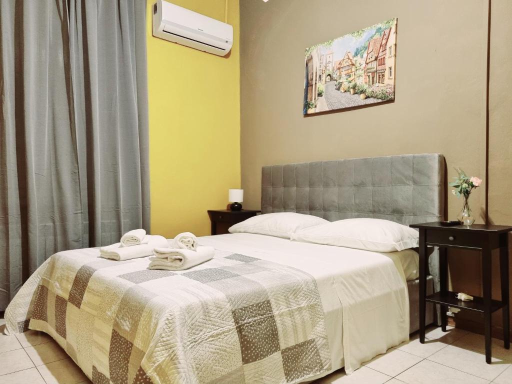 Postel nebo postele na pokoji v ubytování Rose Guest House