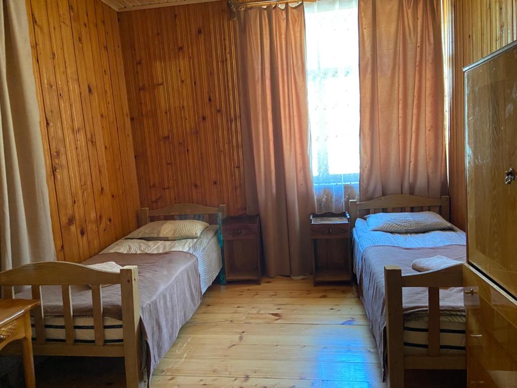 Postel nebo postele na pokoji v ubytování ELISO'S GUESTHOUSE